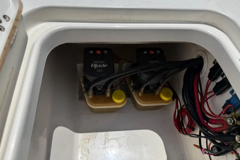 Slide: The Image of Electrical components inside a 2019 Key West 230 Bay Reef boat compartment. - 27