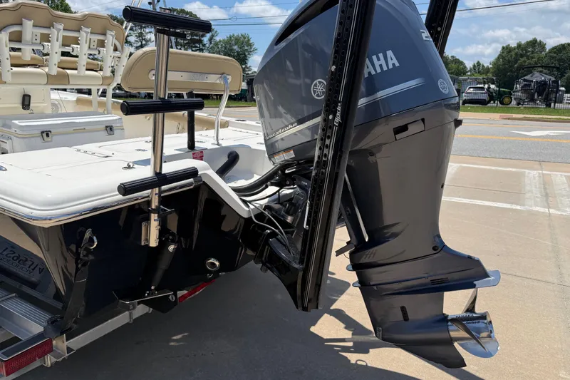 Slide: The Image of 2019 Key West 230 Bay Reef boat with Yamaha outboard motor, docked on pavement. - 9