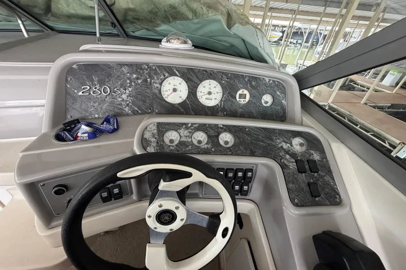 Slide: The Image of 1998 Formula 280 Sun Sport dashboard with steering wheel and instrument panel. - 10
