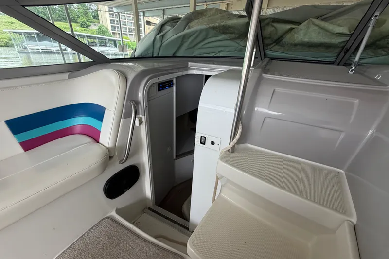 Slide: The Image of Interior of a 1998 Formula 280 Sun Sport boat with seating and cabin entrance. - 13