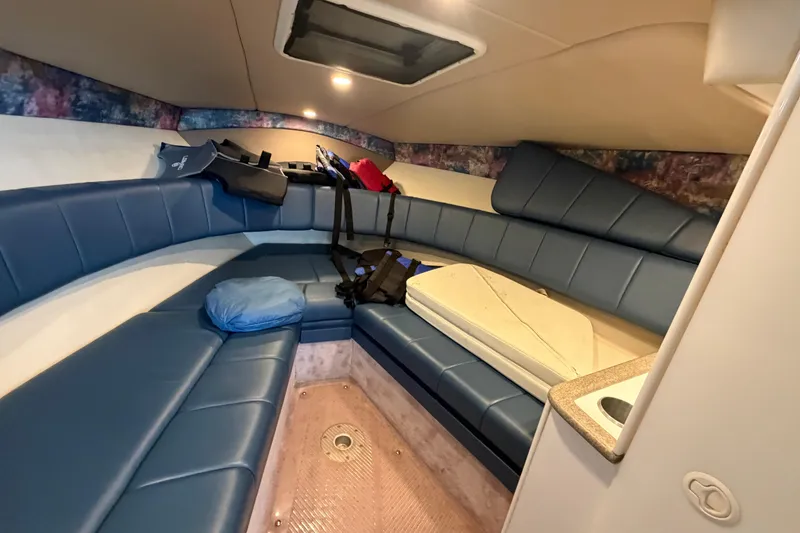 Slide: The Image of Interior cabin of a 1998 Formula 280 Sun Sport boat with blue seating. - 14