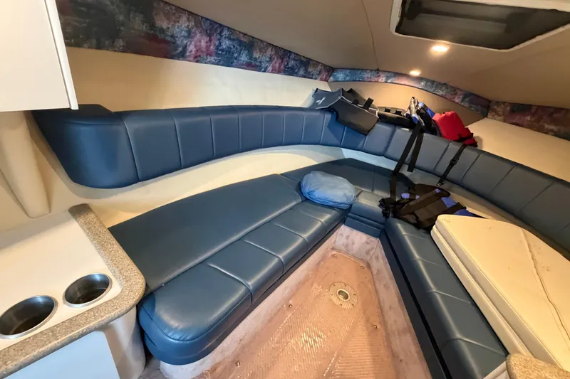 Slide: The Image of Interior of a 1998 Formula 280 Sun Sport boat with blue seating and life jackets. - 15