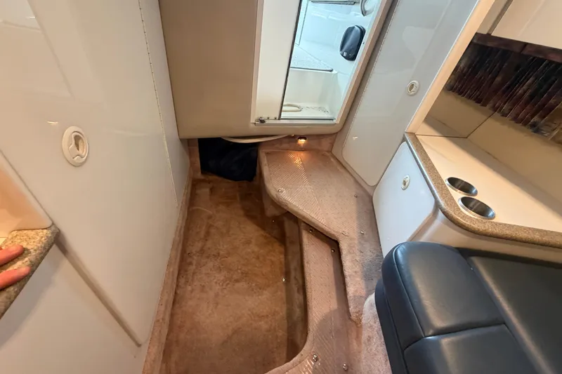 Slide: The Image of Interior of a 1998 Formula 280 Sun Sport boat, featuring seating and storage areas. - 16