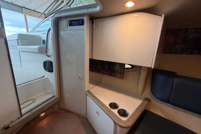 Slide: The Image of Interior cabin of a 1998 Formula 280 Sun Sport boat, featuring seating and storage. - 17