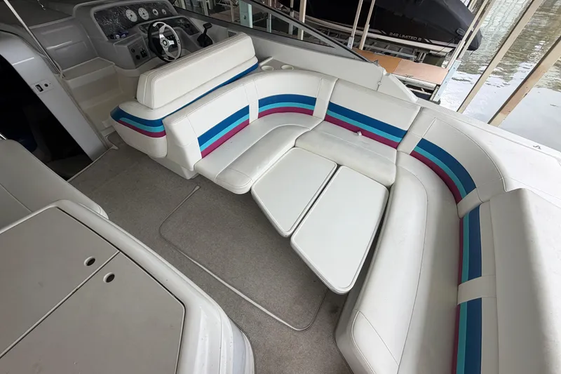 Slide: The Image of Interior of a 1998 Formula 280 Sun Sport boat with colorful seating. - 6