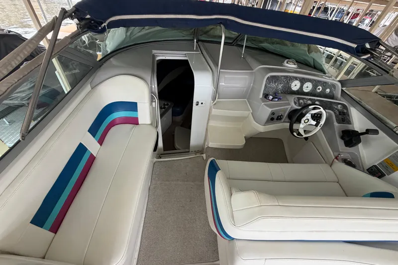 Slide: The Image of 1998 Formula 280 Sun Sport boat interior with white seating and dashboard. - 8