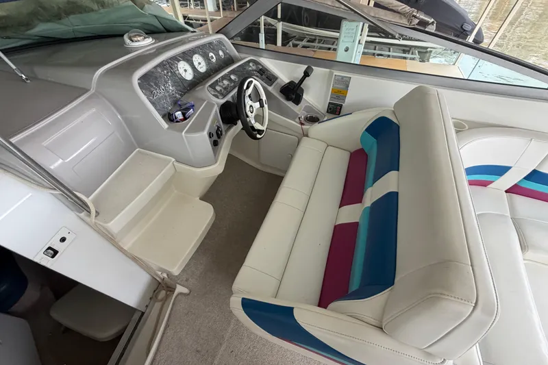 Slide: The Image of 1998 Formula 280 Sun Sport boat interior with colorful seating and dashboard controls. - 9