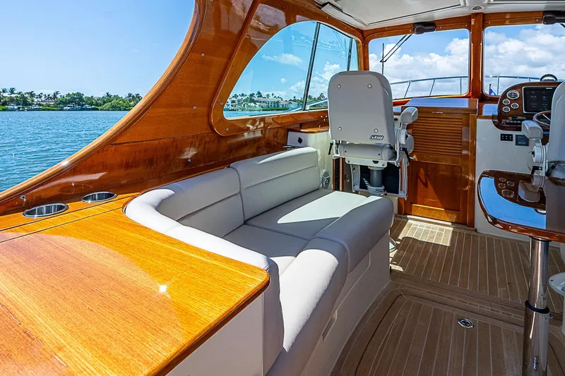 Slide: The Image of Interior of 2016 Hinckley Picnic Boat 37 MKIII with elegant wood finish and seating. - 10