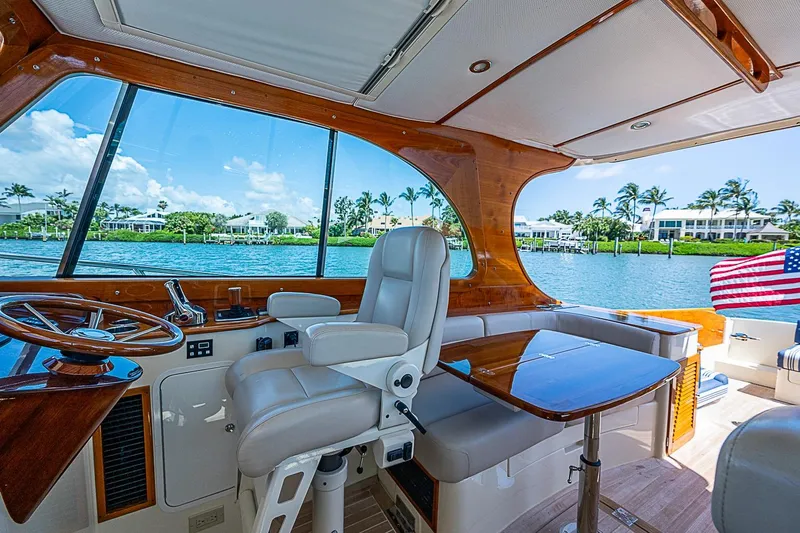 Slide: The Image of Interior of 2016 Hinckley Picnic Boat 37 MKIII with luxurious seating and scenic water view. - 11