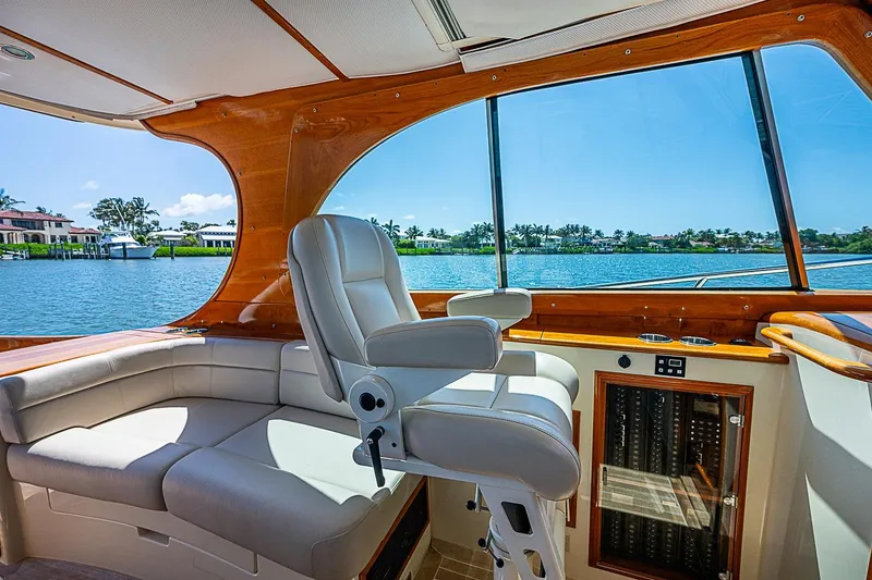 Slide: The Image of Interior of 2016 Hinckley Picnic Boat 37 MKIII with luxurious seating and scenic water view. - 12