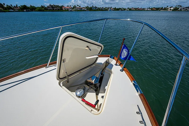Slide: The Image of Hinckley Picnic Boat 37 MKIII (2016) bow with open hatch and scenic water view. - 21