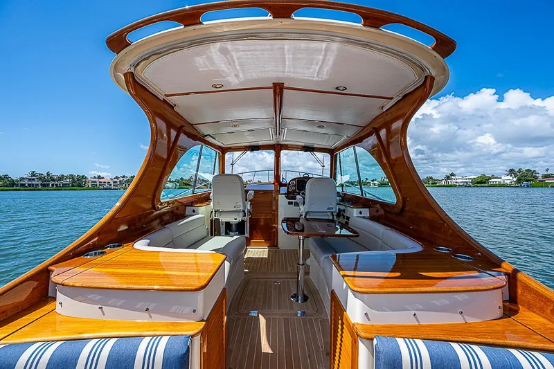 Slide: The Image of 2016 Hinckley Picnic Boat 37 MKIII interior with elegant wood finish on a sunny day. - 8