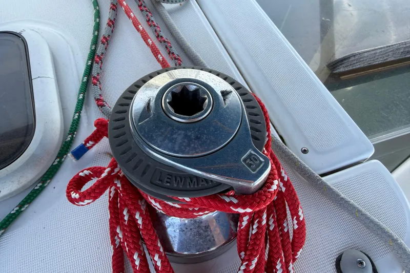 Slide: The Image of Winch with red and green ropes on a 2007 Beneteau 343 sailboat deck. - 13