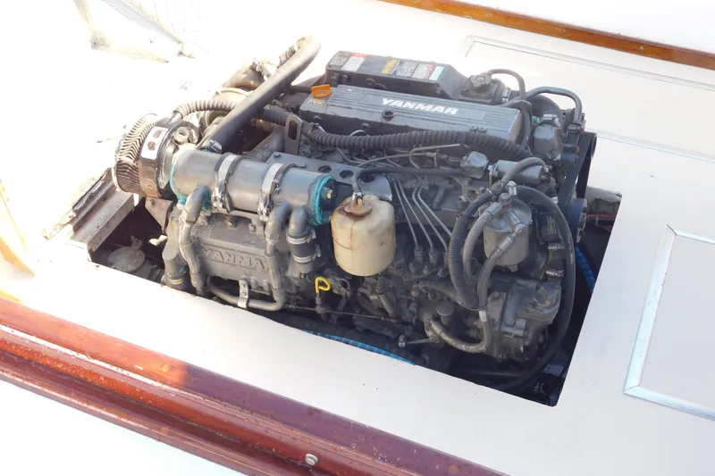 Slide: The Image of Engine of a 1995 Lyman 27 Cruisette boat, featuring a Yanmar diesel engine. - 34