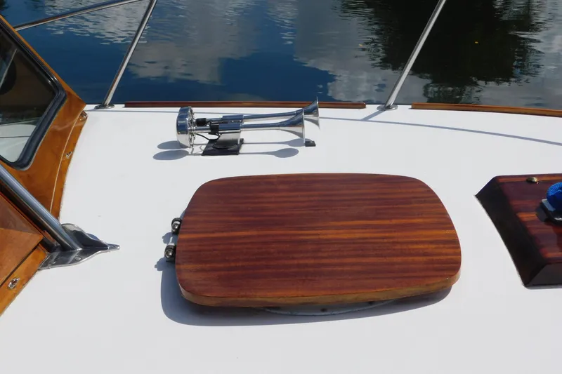 Slide: The Image of Deck of 1995 Lyman 27 Cruisette with wooden hatch and chrome horn. - 9