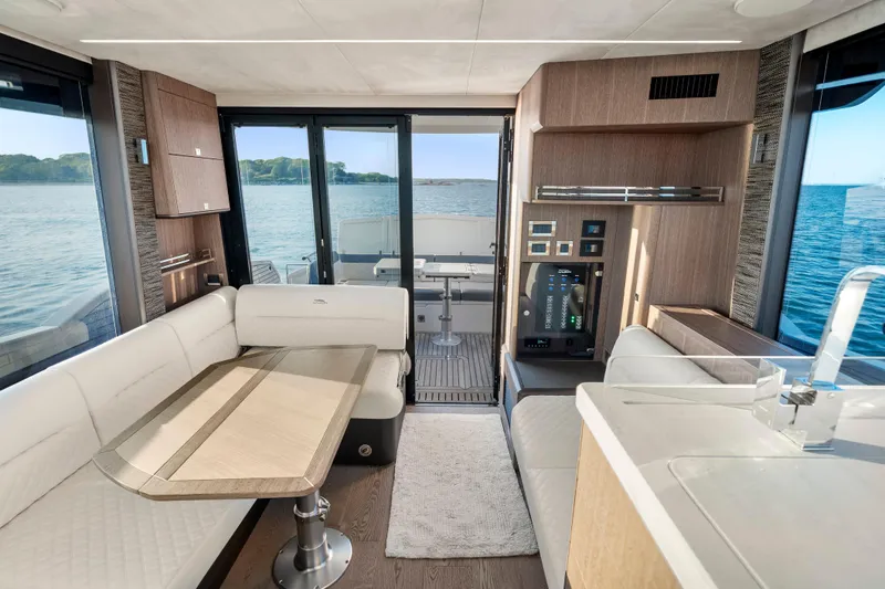 Slide: The Image of Luxurious interior of 2023 Galeon 400 Fly yacht with elegant seating and scenic ocean view. - 17