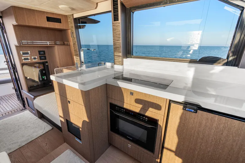 Slide: The Image of Modern kitchen interior of 2023 Galeon 400 Fly yacht with ocean view. - 20