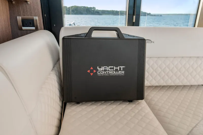 Slide: The Image of Black Yacht Controller case on Galeon 400 Fly's luxurious interior seating, 2023 model. - 24