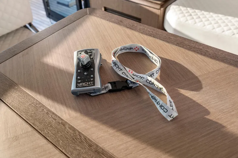 Slide: The Image of Remote control with lanyard on Galeon 400 Fly yacht table, 2023 model. - 25