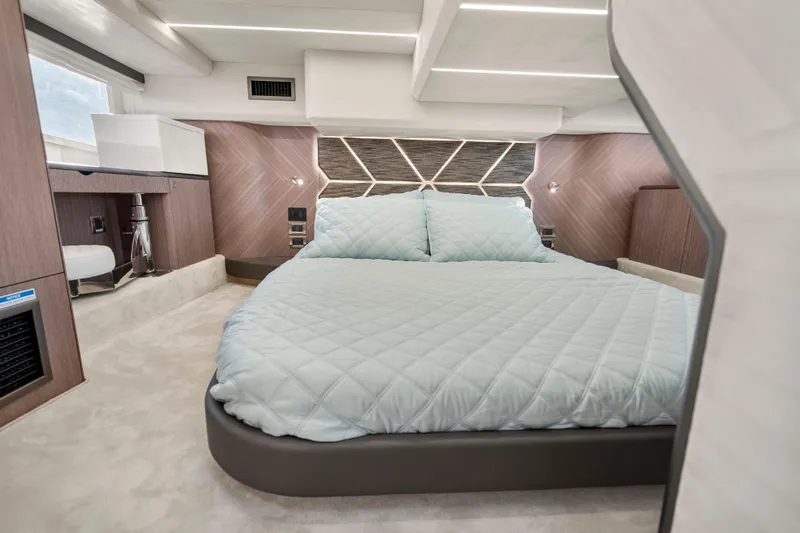 Slide: The Image of Luxurious bedroom interior of 2023 Galeon 400 Fly yacht with modern design and cozy bedding. - 26