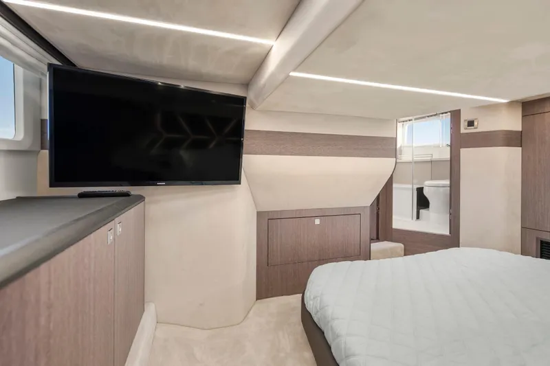 Slide: The Image of Luxurious interior of 2023 Galeon 400 Fly yacht with TV and ensuite bathroom. - 28