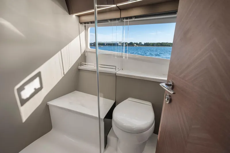 Slide: The Image of Modern bathroom interior on 2023 Galeon 400 Fly yacht with scenic window view. - 31