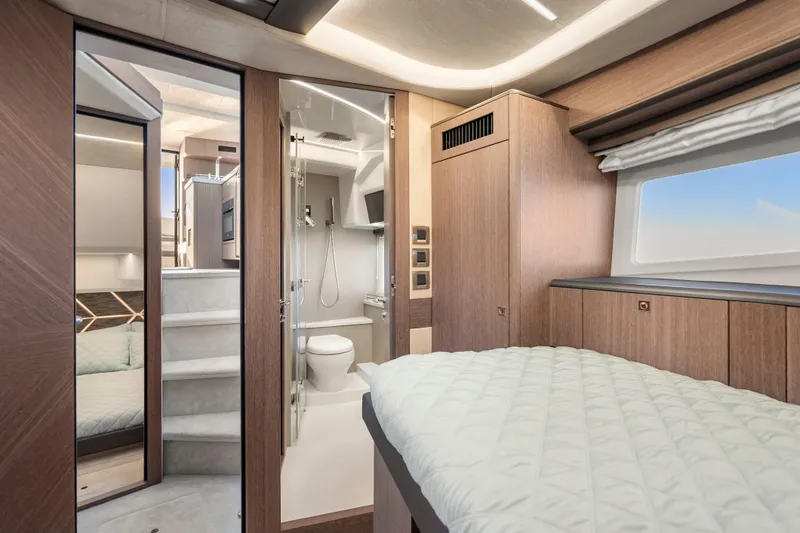 Slide: The Image of Luxurious interior of 2023 Galeon 400 Fly yacht featuring bedroom and modern bathroom. - 35