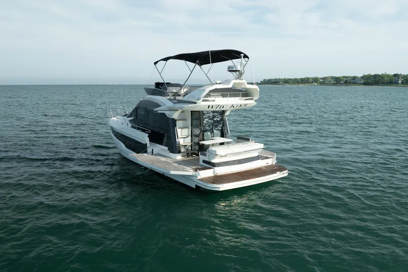 Slide: The Image of 2023 Galeon 400 Fly yacht on open water, rear view with flybridge. - 6
