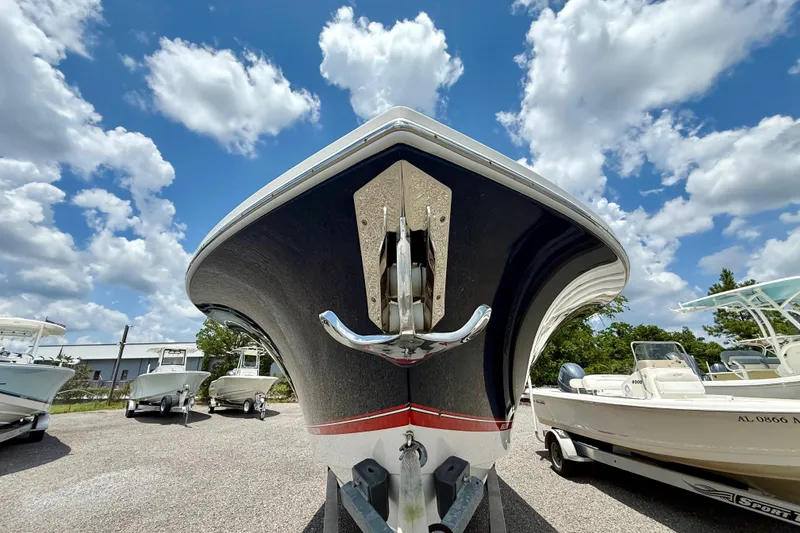 Slide: The Image of 2017 Regulator 28 boat on trailer under blue sky with clouds. - 11