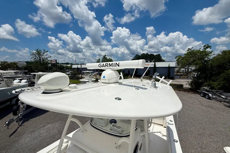 Slide: The Image of 2017 Regulator 28 boat with Garmin radar under a cloudy sky. - 8