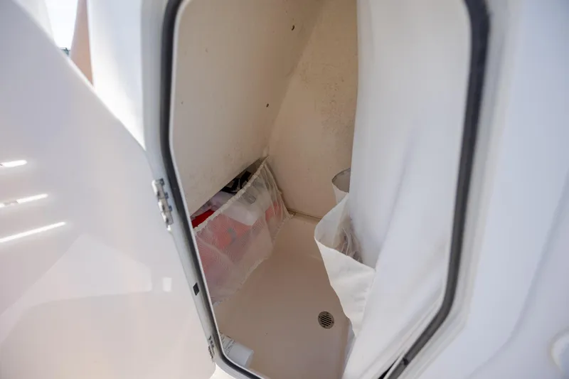 Slide: The Image of Interior storage compartment of 2022 Pioneer 202 Islander boat. - 14