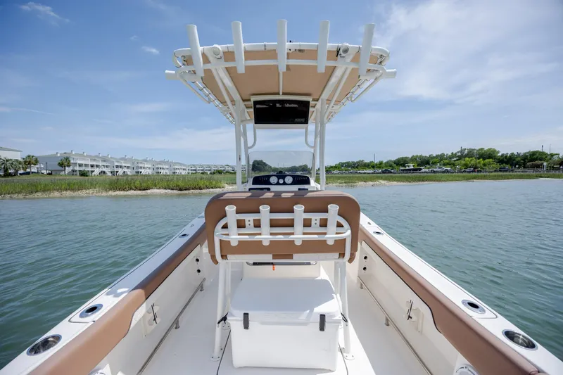Slide: The Image of 2022 Pioneer 202 Islander boat on water, featuring spacious deck and modern design. - 27
