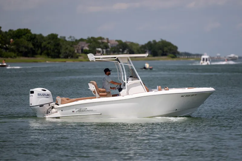 Slide: The Image of 2022 Pioneer 202 Islander boat cruising on a calm lake with Suzuki engine. - 3