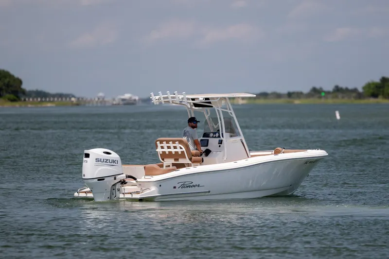 Slide: The Image of 2022 Pioneer 202 Islander boat cruising on a calm waterway with Suzuki engine. - 4