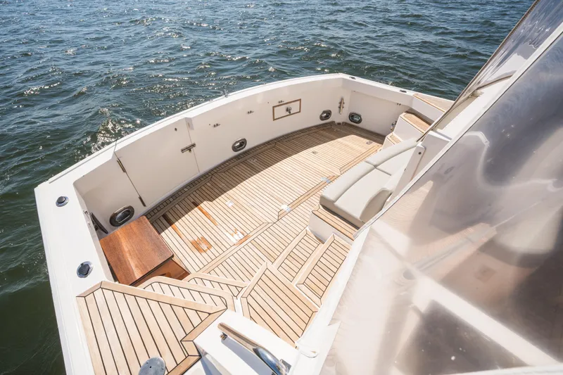 Slide: The Image of 1999 Grand Banks 49 Eastbay HX yacht deck with teak flooring and ocean view. - 10