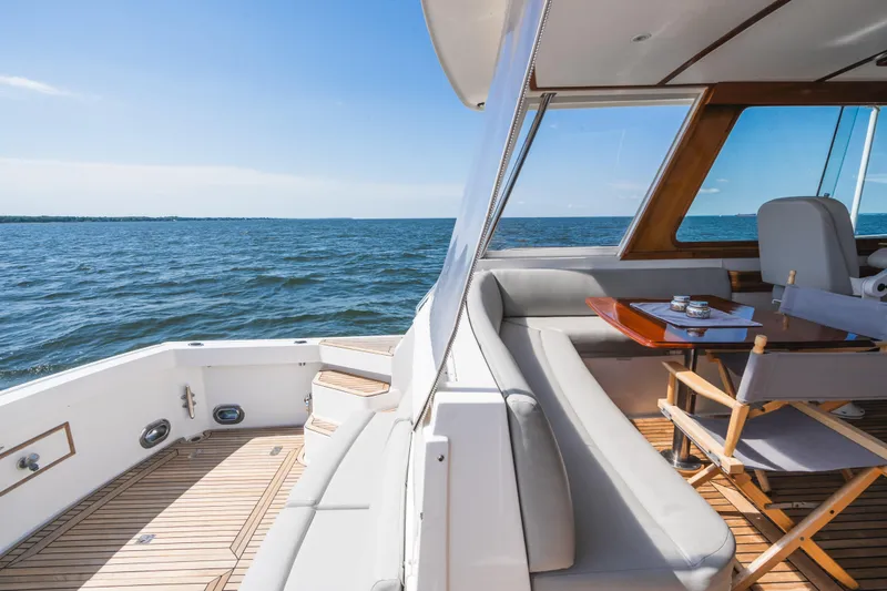 Slide: The Image of 1999 Grand Banks 49 Eastbay HX yacht with elegant seating and ocean view. - 25
