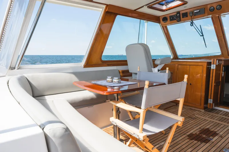 Slide: The Image of Interior of 1999 Grand Banks 49 Eastbay HX yacht with ocean view and seating area. - 26