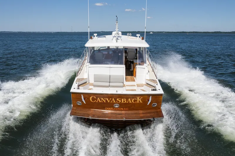 Slide: The Image of 1999 Grand Banks 49 Eastbay HX yacht cruising on open water. - 3