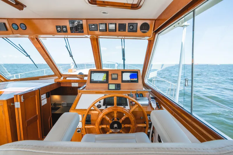 Slide: The Image of Helm of 1999 Grand Banks 49 Eastbay HX yacht with ocean view. - 35