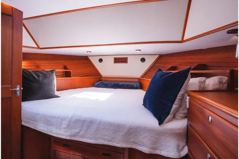 Slide: The Image of Luxurious cabin interior of 1999 Grand Banks 49 Eastbay HX yacht with cozy bedding. - 49