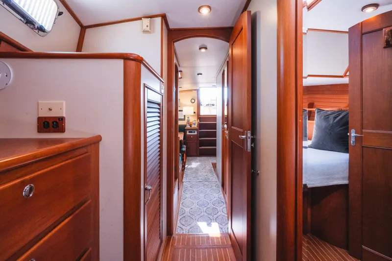 Slide: The Image of Luxurious interior of 1999 Grand Banks 49 Eastbay HX yacht with wooden finishes. - 53