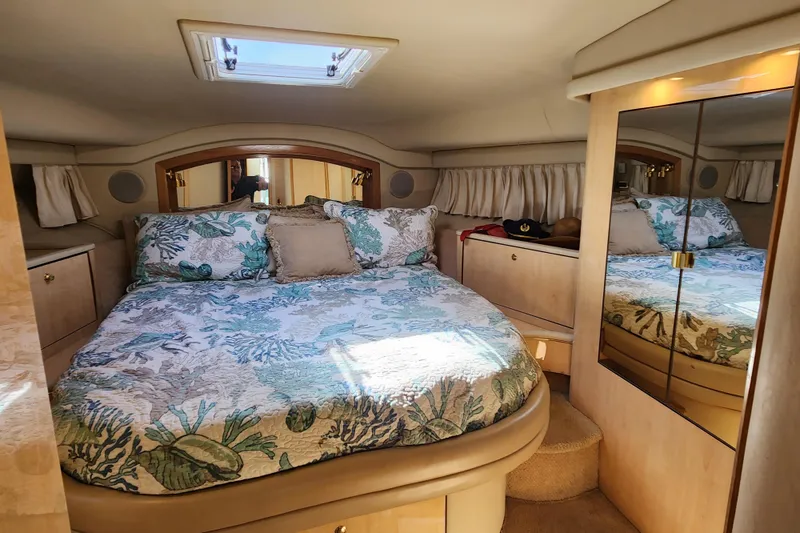Slide: The Image of Luxurious bedroom interior of 2001 Sea Ray 400 Sedan Bridge yacht. - 17