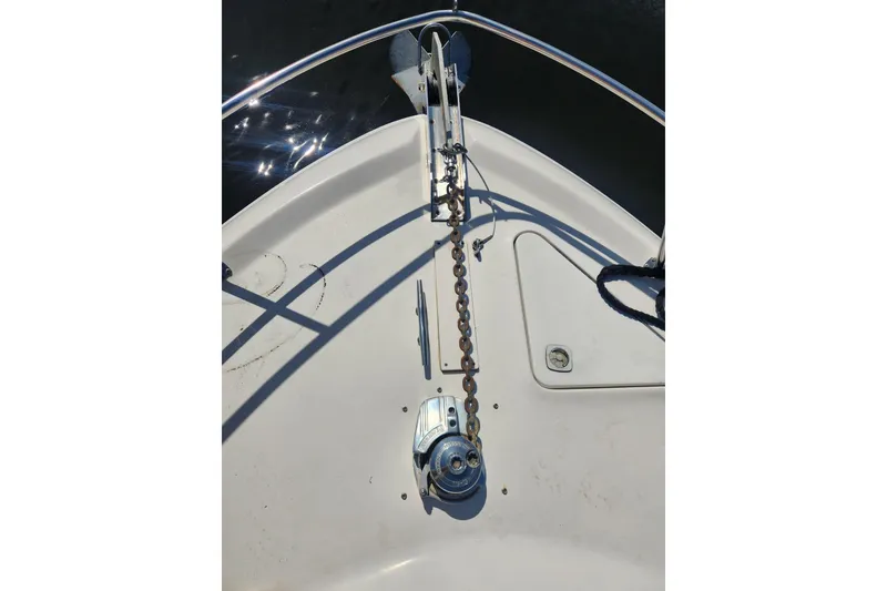 Slide: The Image of Bow of 2001 Sea Ray 400 Sedan Bridge with anchor chain and winch. - 4