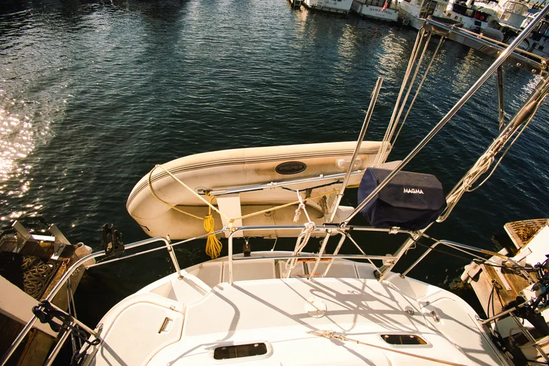 Slide: The Image of 1994 Hunter Passage yacht with dinghy in harbor. - 1