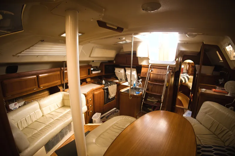 Slide: The Image of Interior of a 1994 Hunter Passage yacht with wooden furnishings. - 13