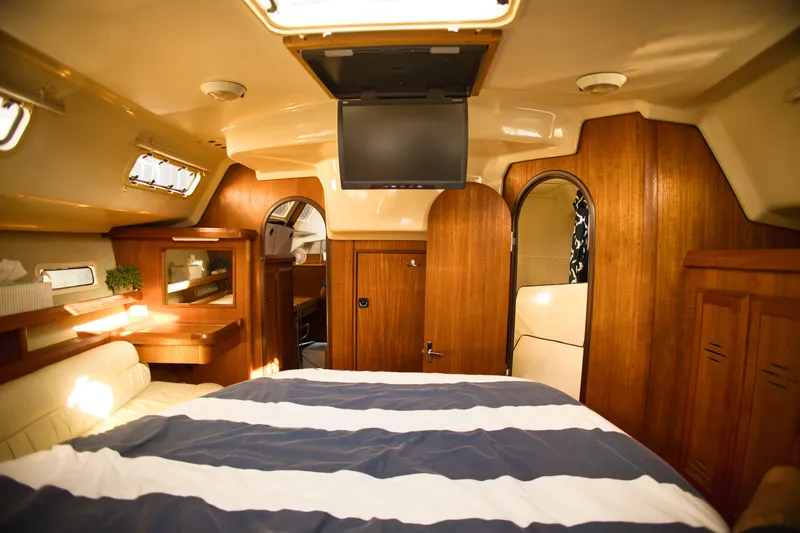 Slide: The Image of Interior of a 1994 Hunter Passage yacht with wood finish. - 19