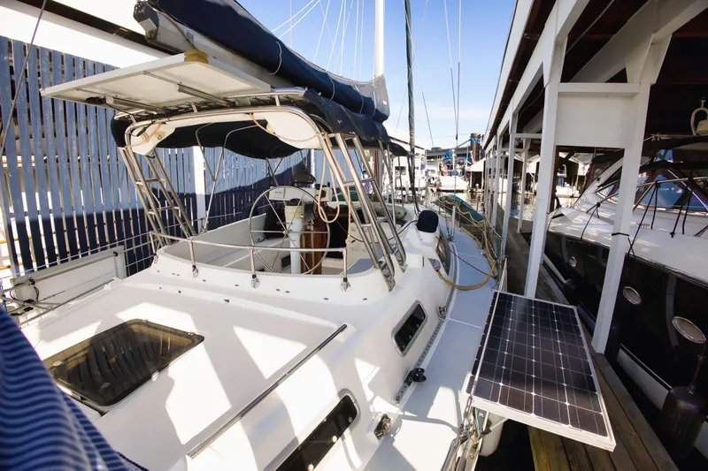 Slide: The Image of 1994 Hunter Passage sailboat docked with solar panel. - 3