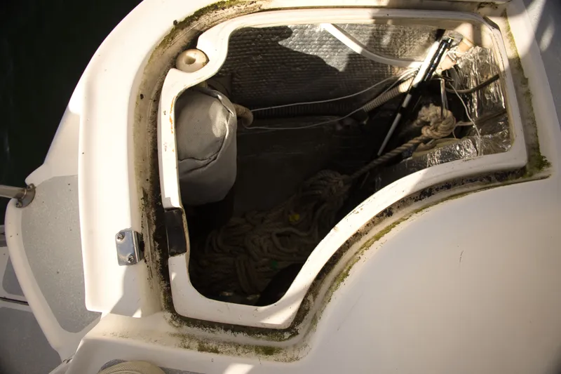 Slide: The Image of Hatch opening of a 1994 Hunter Passage boat with ropes. - 7