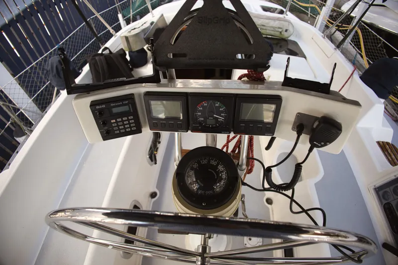 Slide: The Image of 1994 Hunter Passage yacht helm with navigation instruments. - 10