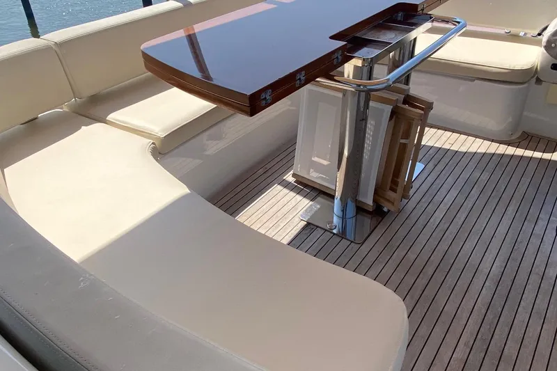Slide: The Image of Luxurious seating area on 2014 Azimut Magellano 50 yacht with wooden table. - 10